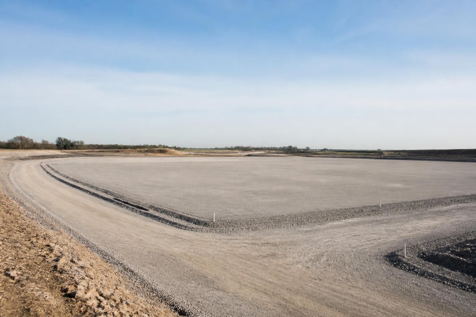 Finished civil works site with open space and prepared pad